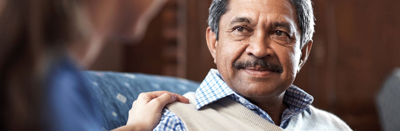 An older man with a healthcare professional